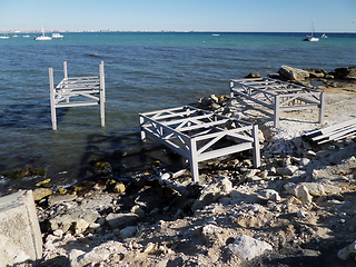 Image showing Iron structures on the shore.