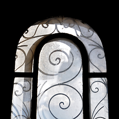 Image showing sunlight on dusty arched window