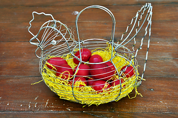 Image showing red easter eggs chicken basket