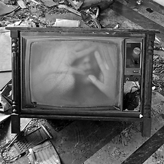 Image showing ghostly figure on vintage tv set