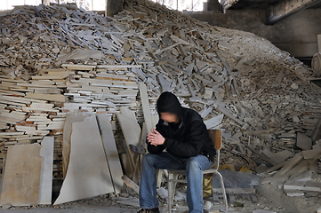 Image showing man and pile of broken marble
