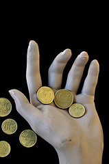 Image showing spare change worn hand holding money coins