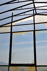 Image showing sunlight reflected on broken glass