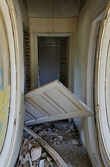 Image showing unhinged door abandoned house corridor