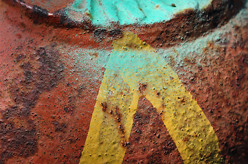 Image showing yellow arrow on rusty metal surface