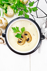 Image showing Soup puree of champignon in bowl on table top