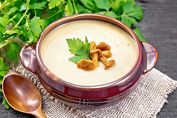 Image showing Soup puree of chanterelle in bowl on black board