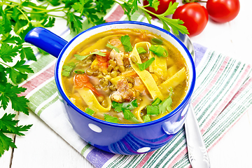 Image showing Soup with mung and noodles in blue bowl on white board