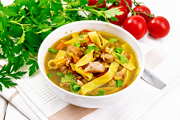 Image showing Soup with mung and noodles in bowl on board