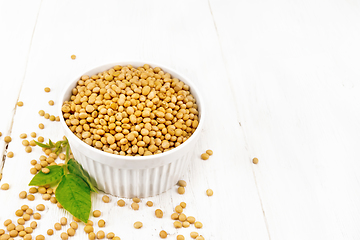 Image showing Soybeans in bowl with leaf on light board