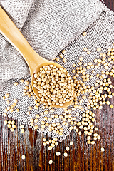 Image showing Soybeans in spoon on dark board top