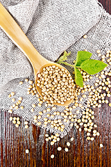 Image showing Soybeans in spoon with leaf on board top