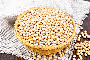 Image showing Soybeans in wicker bowl on dark board