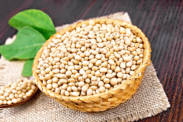 Image showing Soybeans in wicker bowl with leaf on board