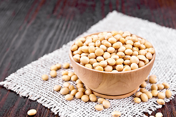 Image showing Soybeans in wooden bowl on board