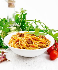 Image showing Spaghetti with bolognese in plate on white board