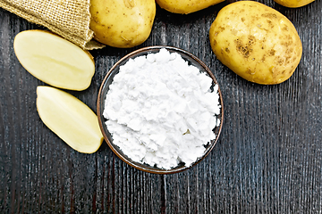 Image showing Starch potato in clay bowl on board top