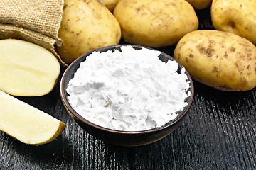 Image showing Starch potato in clay bowl on board