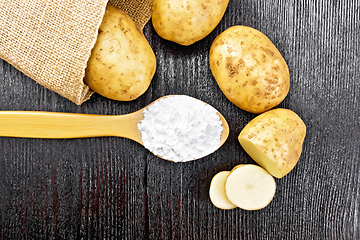 Image showing Starch potato in spoon on board top