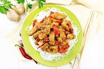 Image showing Stir-fry of chicken with peppers in plate on board top