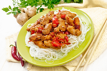 Image showing Stir-fry of chicken with peppers in plate on light board