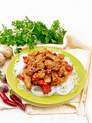 Image showing Stir-fry of chicken with peppers in plate on napkin