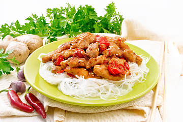 Image showing Stir-fry of chicken with peppers in plate on white board