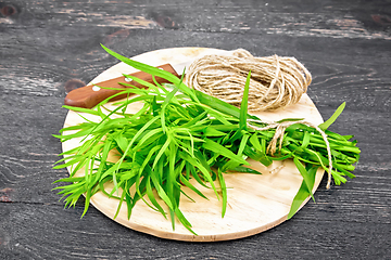 Image showing Tarragon with knife on black board