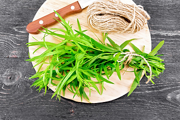 Image showing Tarragon with knife on board top