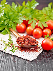 Image showing Tomatoes dried in spoon on black board