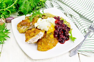 Image showing Turkey breast with cranberry sauce on board