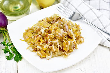 Image showing Turnip fried in plate on white wooden board