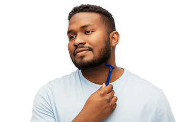 Image showing african man shaving beard with razor blade