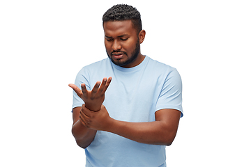 Image showing african american man suffering from pain in hand