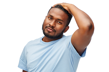 Image showing african american man touching his hair