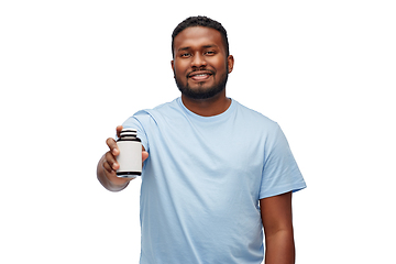 Image showing smiling african american man with medicine jar