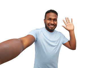 Image showing smiling young african american man taking selfie