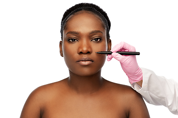 Image showing face of african woman and hand with marker