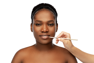 Image showing face of african woman and hand with make up brush