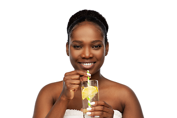 Image showing african american woman with glass of fruit water