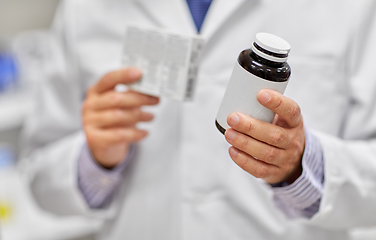 Image showing close up of pharmacist with medicine at pharmacy