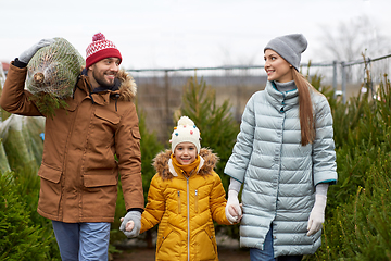 Image showing happy family buying christmas tree at market