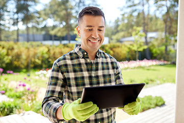 Image showing man with tablet pc at summer garden