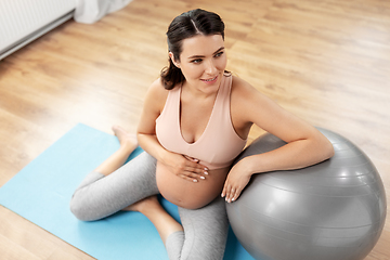 Image showing happy pregnant woman with fitball at home