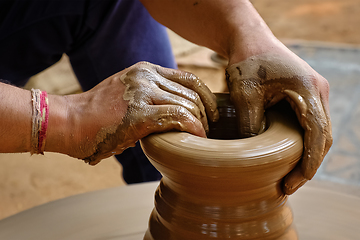 Image showing Indian potter hands at work, Shilpagram, Udaipur, Rajasthan, India