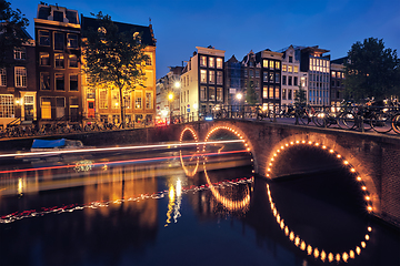 Image showing Amterdam canal, bridge and medieval houses in the evening