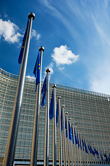 Image showing EU European Union flags in front of European Comission building in Background. Brussles, Belgium