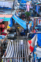 Image showing Dhobi Ghat is an open air laundromat lavoir in Mumbai, India with laundry drying on ropes