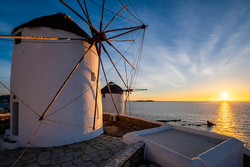 Image showing Traditional greek windmills on Mykonos island at sunrise, Cyclades, Greece