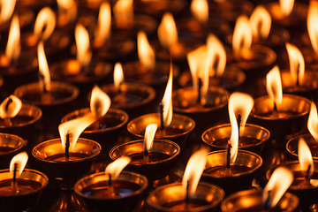 Image showing Burning candles in Buddhist temple